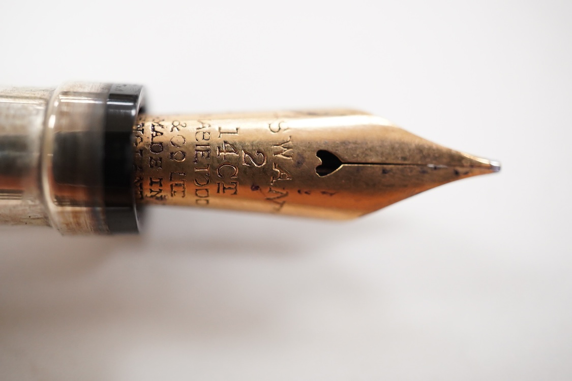 A Mabie Todd & Co. Swan Sterling silver twist filler, Made in England with 14ct. gold nib